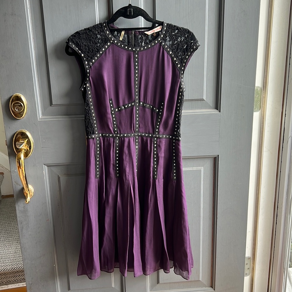 Lace back, high neck, bordered with silver gems